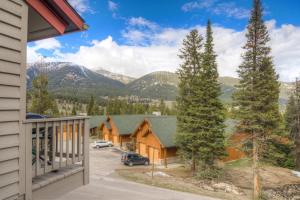 a view from the balcony of a house with mountains at 382 Sunburst in Big Sky