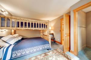 a bedroom with a bunk bed with a ladder at 382 Sunburst in Big Sky +38 photos