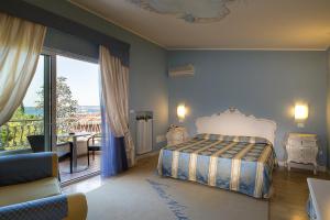 Posteľ alebo postele v izbe v ubytovaní Hotel Serenella