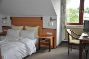 Postel nebo postele na pokoji v ubytování Hotel Gasthof Vogelsang
