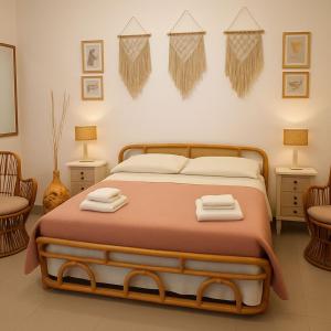 a bedroom with a bed with two towels on it at LA MURGIA casa vacanze B&B in Grumo Appula
