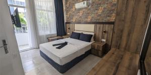 Ένα ή περισσότερα κρεβάτια σε δωμάτιο στο Ramona Kale Hotel