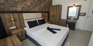 Ένα ή περισσότερα κρεβάτια σε δωμάτιο στο Ramona Kale Hotel