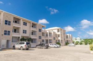 a parking lot in front of a large apartment building at Chic & Luxurious Flat in Cedar Grove
