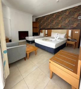 Ένα ή περισσότερα κρεβάτια σε δωμάτιο στο Ramona Kale Hotel