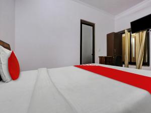 Postel nebo postele na pokoji v ubytování Hotel O URBANS ROOM