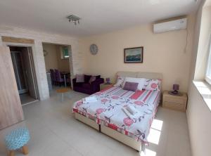 a bedroom with a bed and a living room at Villa Apartments Kumbor President in Kumbor +45 photos