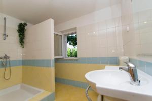 Koupelna v ubytování Apartment and rooms Jurišić + 37 fotografií