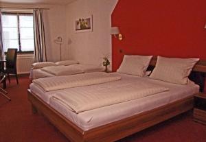Postel nebo postele na pokoji v ubytování Hotel Beller