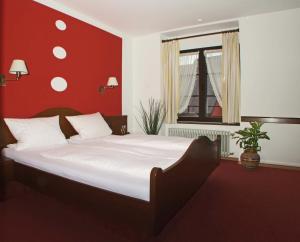 Postel nebo postele na pokoji v ubytování Hotel Beller