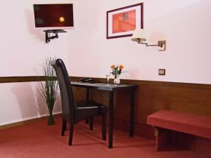 TV a/nebo společenská místnost v ubytování Hotel Beller