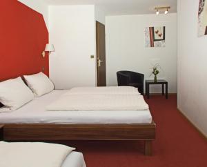 Postel nebo postele na pokoji v ubytování Hotel Beller