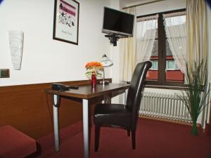 TV a/nebo společenská místnost v ubytování Hotel Beller