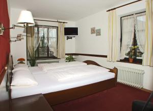 Postel nebo postele na pokoji v ubytování Hotel Beller