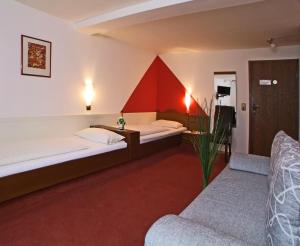 Postel nebo postele na pokoji v ubytování Hotel Beller