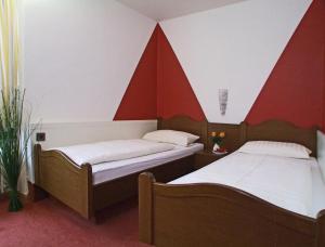 Postel nebo postele na pokoji v ubytování Hotel Beller
