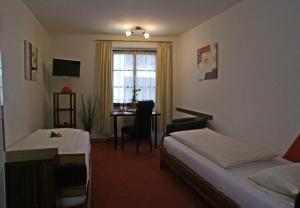 Postel nebo postele na pokoji v ubytování Hotel Beller
