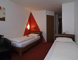 Postel nebo postele na pokoji v ubytování Hotel Beller