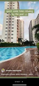 マニラにあるSMDC South Residencesのプール写真付きのサイトのスクリーンショット