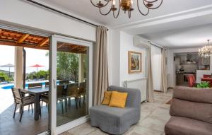 a living room with a table and a dining room at Villa Stanzia Natura Crikvenica by Villas Guide in Bakarac