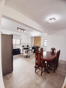 a kitchen and dining room with a table and chairs at HighlandRose Heaven Peace near Tribeca mall in Hermitage
