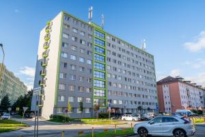 a white car parked in front of a building at Luxapartment ll Krivá in Košice