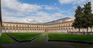 a large building with a green lawn in front of it at La Dolce Mela in Buonabitacolo