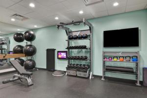 a room with a gym with a flat screen tv at Tru By Hilton Augusta Washington Road in Augusta
