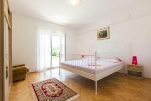 Postel nebo postele na pokoji v ubytování SAN Apartments