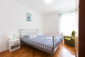 Postel nebo postele na pokoji v ubytování SAN Apartments