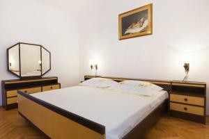 Postel nebo postele na pokoji v ubytování SAN Apartments