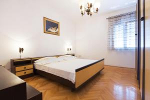 Postel nebo postele na pokoji v ubytování SAN Apartments