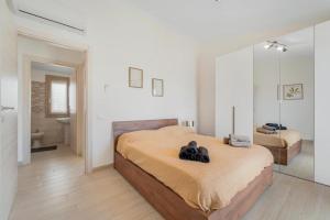 En eller flere senge i et værelse på Villa Bianca