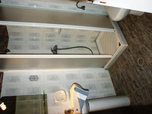 a small kitchen with a sink and a wall at Plaka Hotel I in Plaka