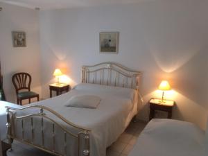 Ein Bett oder Betten in einem Zimmer der Unterkunft Maison Tobias