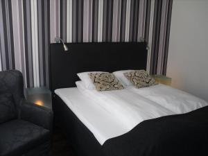 Letto o letti in una camera di First Hotel Witt