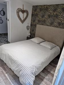 Ένα ή περισσότερα κρεβάτια σε δωμάτιο στο Appartement moderne
