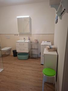 a small bathroom with a sink and a toilet at Apartment On The Upper Floor in Bokelrehm