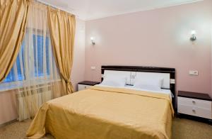 Postel nebo postele na pokoji v ubytování Noy Hotel
