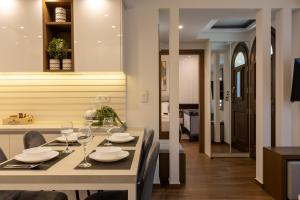 a dining room with a table with wine glasses on it at The Monolith in Kalabaka