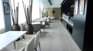 a dining room with white tables and white chairs at Jinjiang Inn Yancheng Funing Harbin Road in Yancheng +86 photos