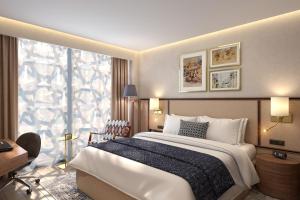 Postel nebo postele na pokoji v ubytování Makarem Burj Al Madinah + 90 fotografií