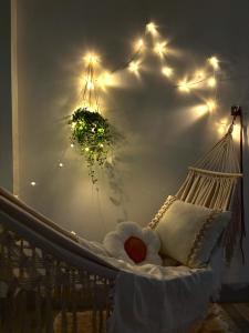 a hammock with a teddy bear in it at Ariel Homestay in Quy Nhon