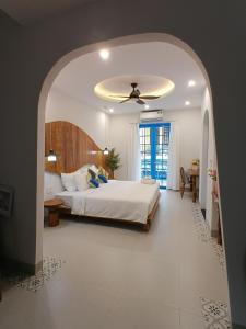Ένα ή περισσότερα κρεβάτια σε δωμάτιο στο LG Villa My Khe Beach +15 φωτογραφίες