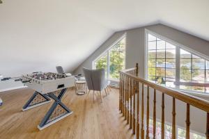 a room with a ping pong table in a house at Spa Lake - Naturo lac Sept-Iles in Saint-Raymond +18 photos