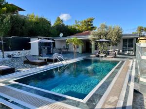 a swimming pool in the backyard of a house at Casa Loma 2 RHODES-FAMILY VILLA,PRIVATE POOL & FARM in Rhodes Town