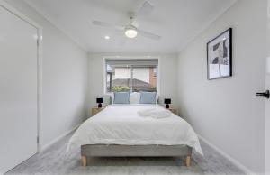 Ένα ή περισσότερα κρεβάτια σε δωμάτιο στο Renovated Cozy Family house - Wi-Fi, Parking