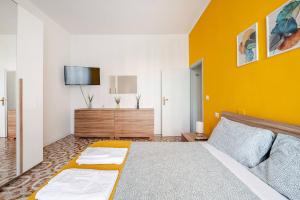 a bedroom with a bed and a tv on a wall at Interamna House, intero appartamento exclusive use in Terni +15 photos