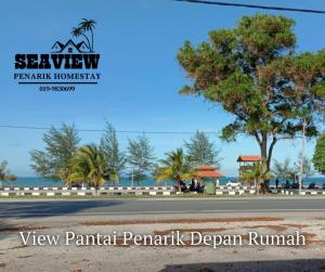 a view of a road in front of the ocean at SeaView Homestay in Kampong Ru Sepuloh