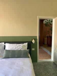 Ένα ή περισσότερα κρεβάτια σε δωμάτιο στο La Palma Oasi Urbana